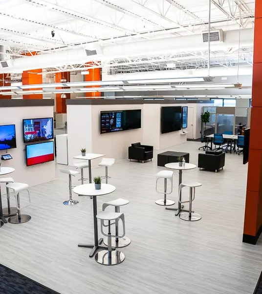 Open collaboration lounge with high-top seating at World Park