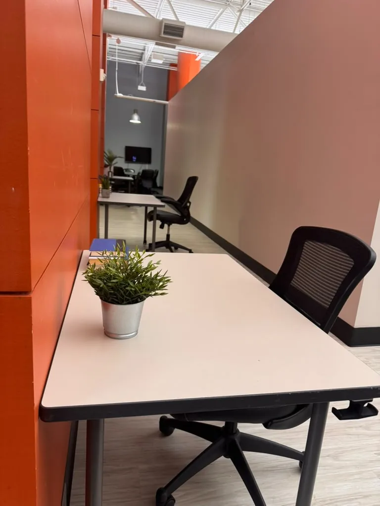 Dedicated desk in the open coworking space at World Park Alpharetta