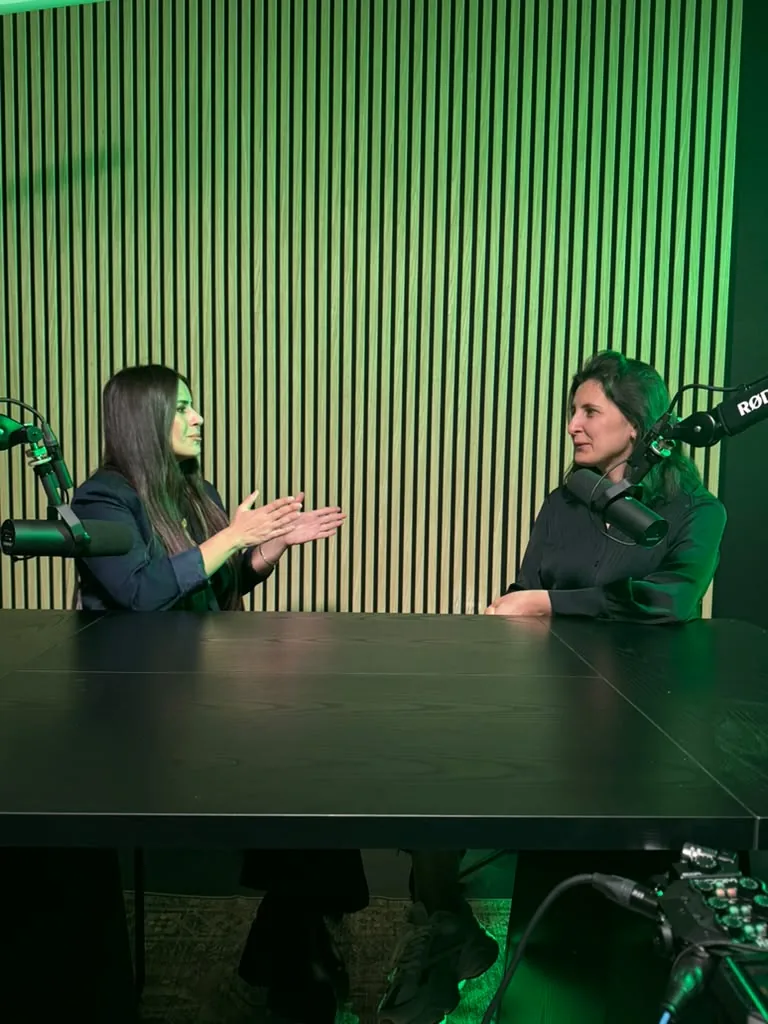 Two guests recording the first podcast episode in the World Park podcast studio in Alpharetta