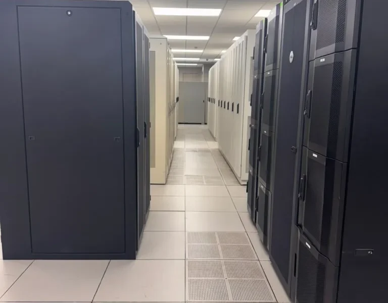 Row of black server cabinets on a raised tile floor in the MarQi Cloud data hall at World Park Alpharetta