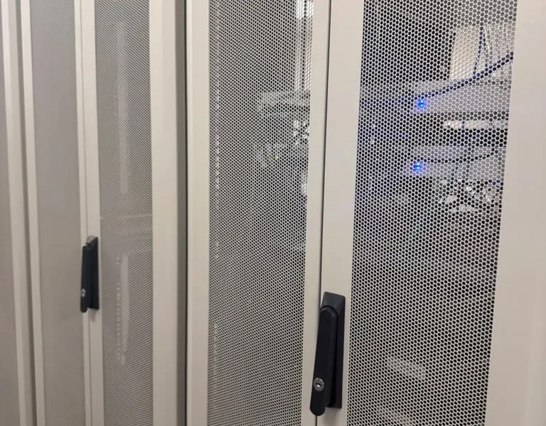 Rear mesh doors and structured cabling on colocation cabinets at the MarQi Cloud data center in Alpharetta, Georgia
