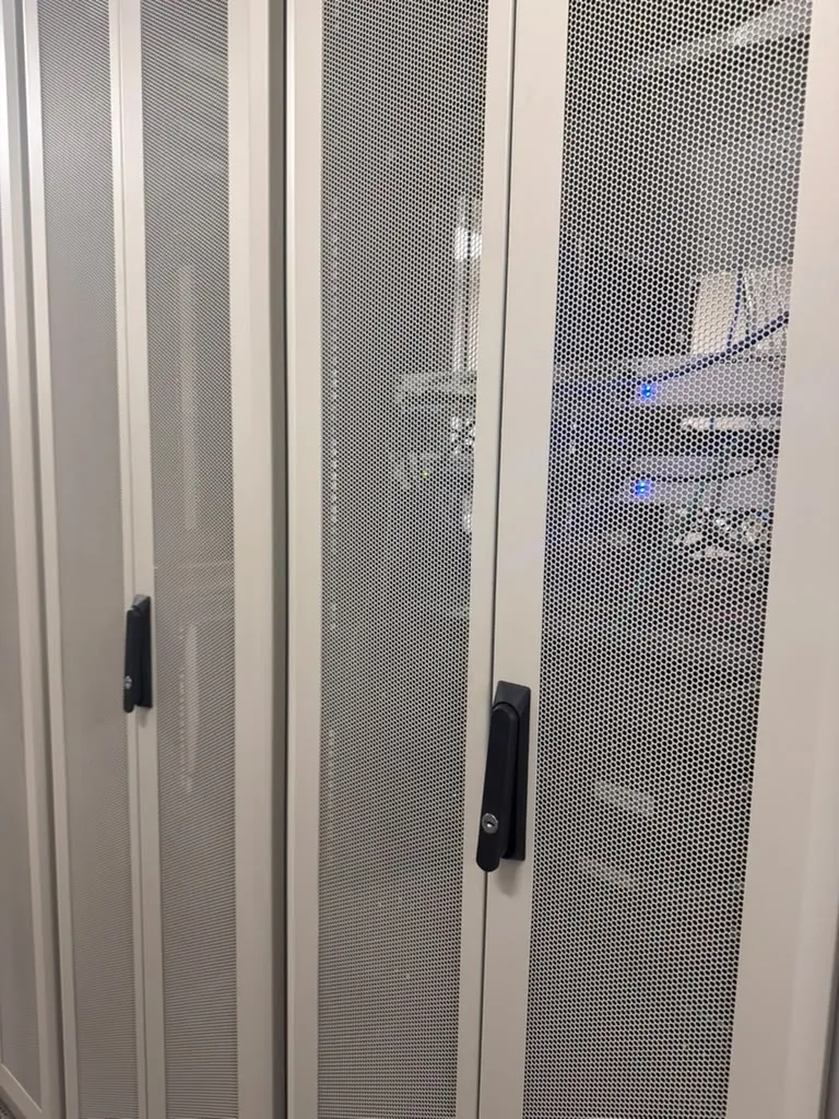 Rear mesh doors and structured cabling on colocation cabinets at the MarQi Cloud data center in Alpharetta, Georgia