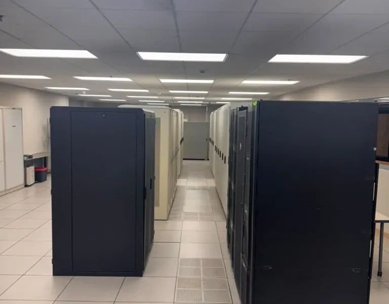 Rows of enclosed server cabinets in the MarQi Cloud data hall at World Park in Alpharetta, Georgia