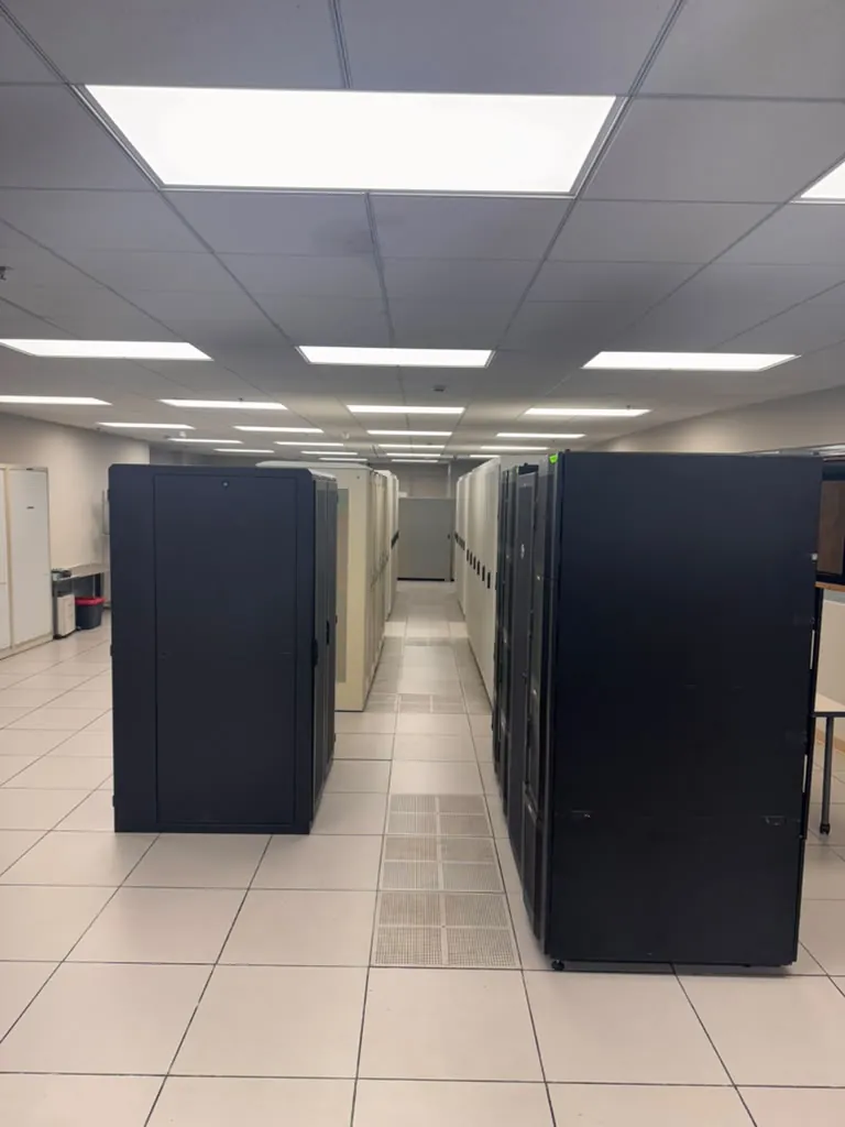 Rows of enclosed server cabinets in the MarQi Cloud data hall at World Park in Alpharetta, Georgia