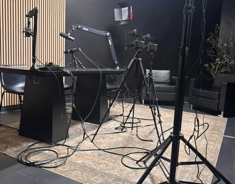 Studio lighting and microphone stands in the World Park podcast studio in Alpharetta, Georgia