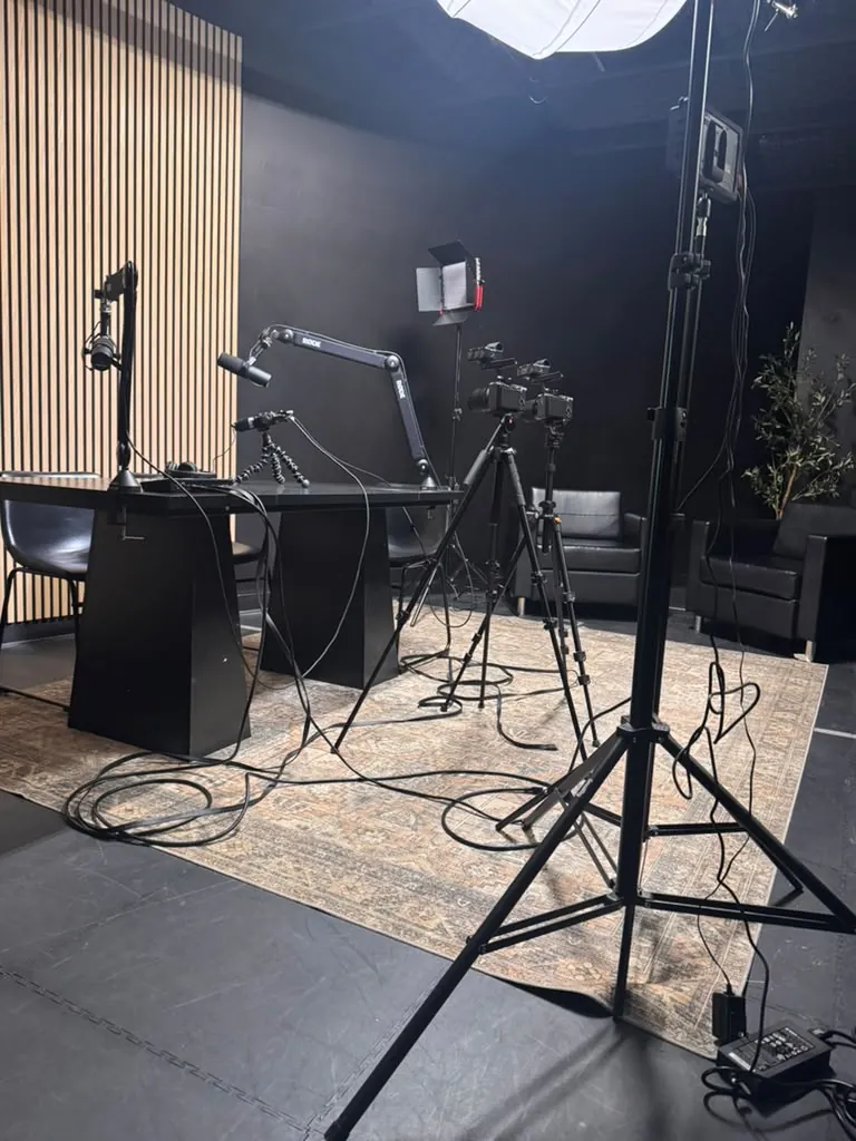 Studio lighting and microphone stands in the World Park podcast studio in Alpharetta, Georgia