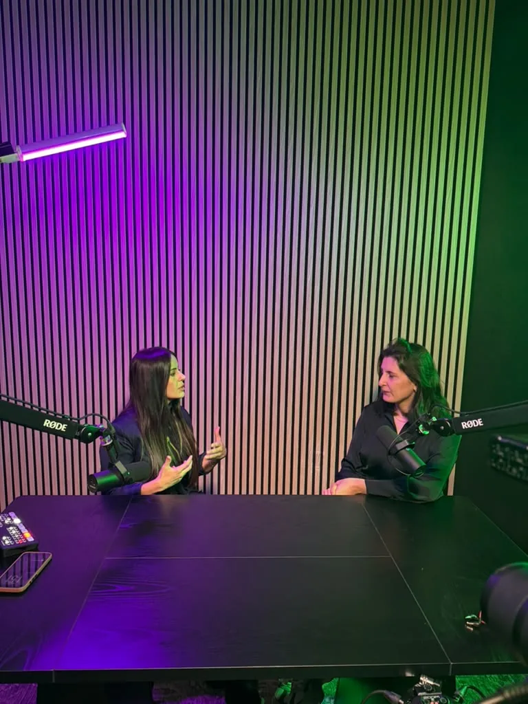 Podcast recording session with RODE microphones and wood slat wall at World Park