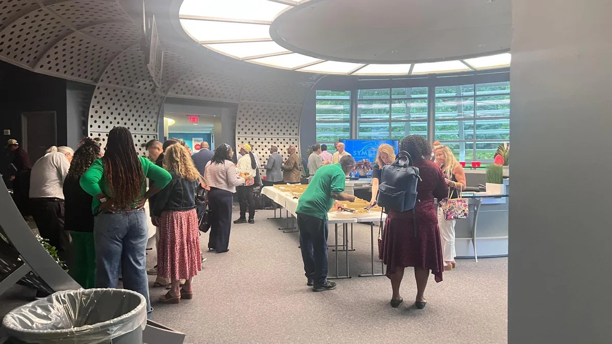 Networking reception in the World Park theater lobby during the WealthWave Green Carpet event